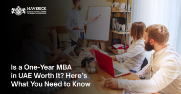 A professional business meeting with a presenter explaining concepts on a whiteboard while colleagues engage in discussion. The image represents career growth, leadership, and education, aligning with the blog "Is a One-Year MBA in UAE Worth? Here’s What You Need to Know.