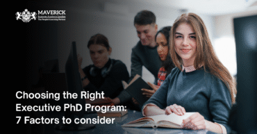 Group of diverse students studying in a classroom setting with a smiling female student in focus; Maverick Business Academy London branding displayed.